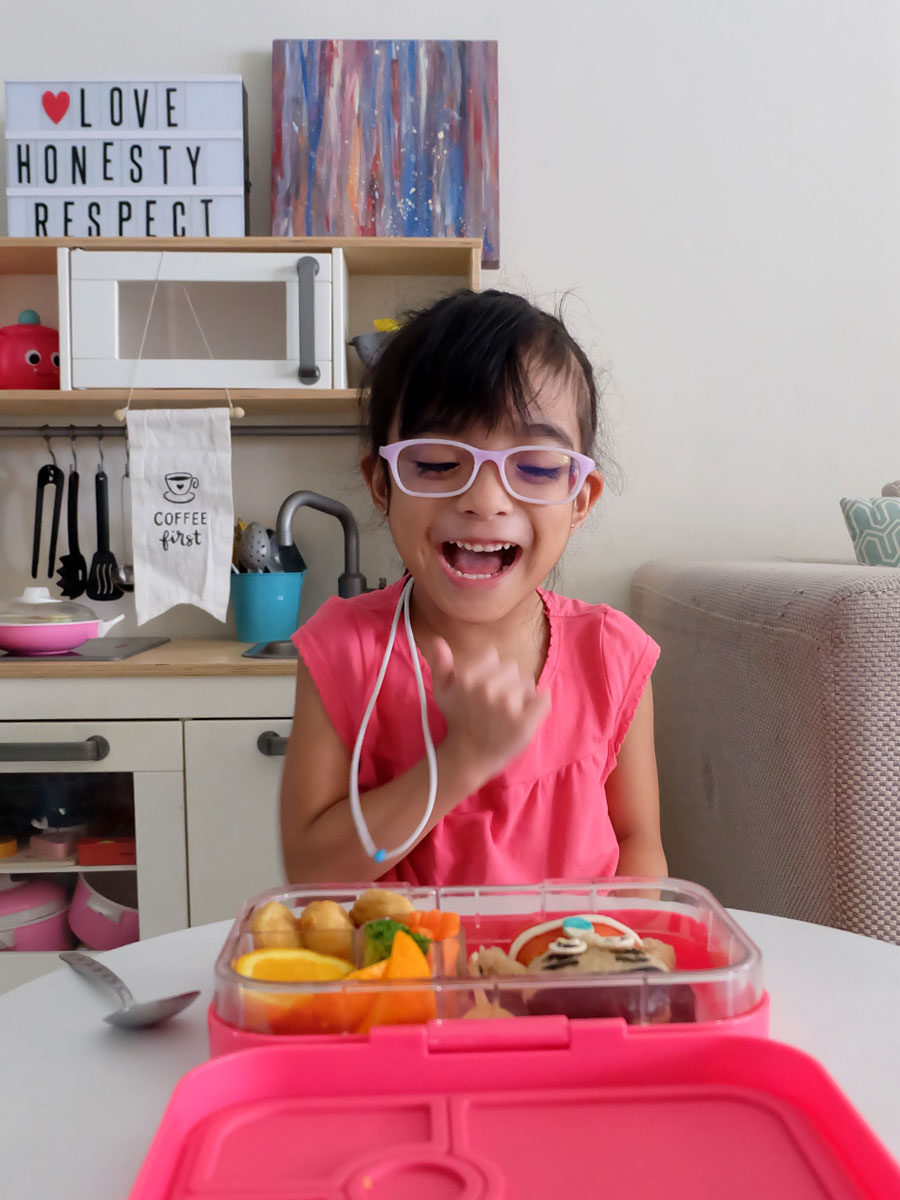 Zoë enjoying her Moana Bento Food Art